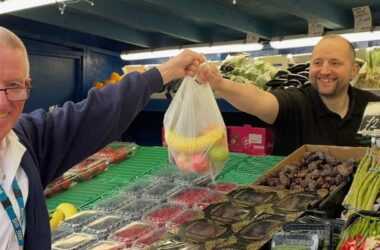 A staff member collects a free bag of fruit at Newcastle Hospitals, as part of Nutrition and Hydration Week